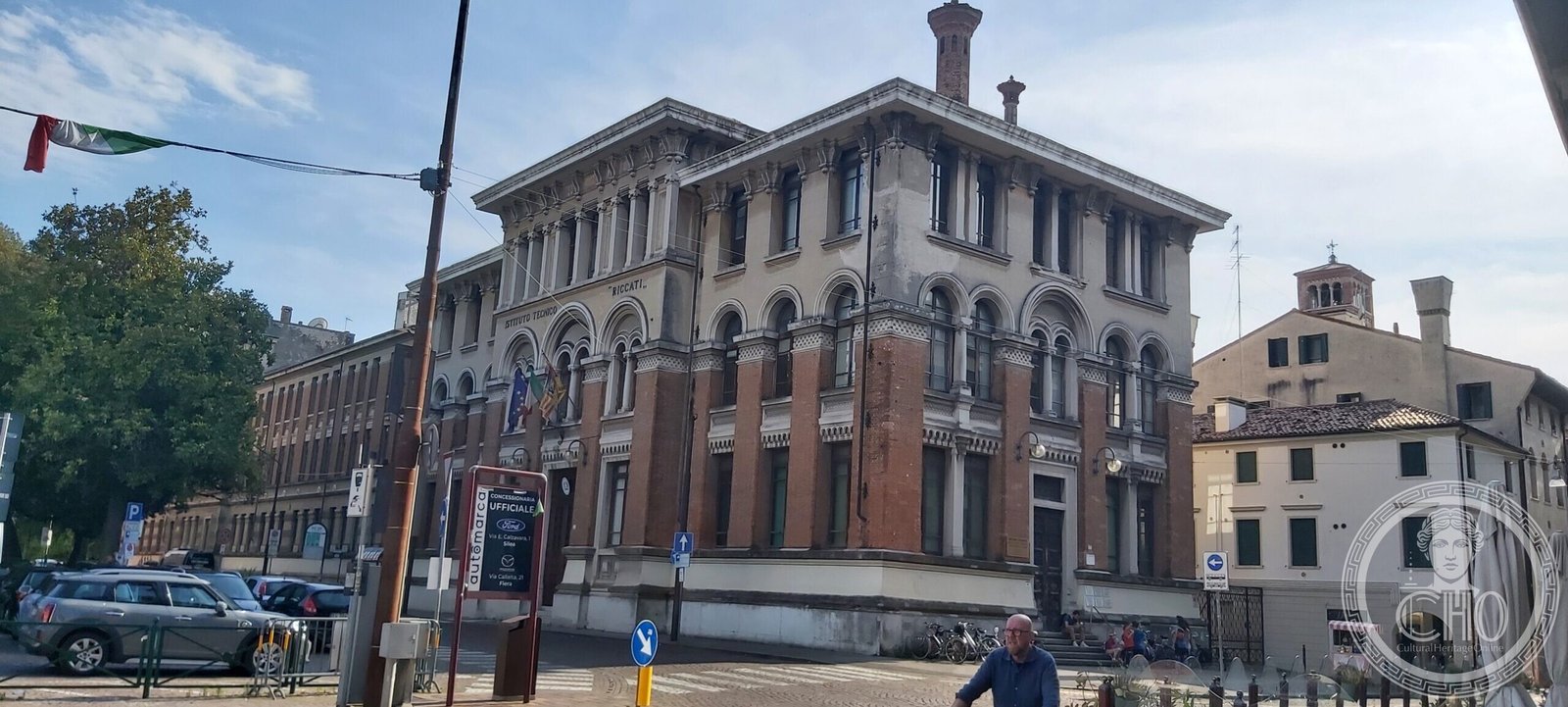 The corner pavilion of the Riccati building seen from across the street, with its paired arched windows and eaves loggia