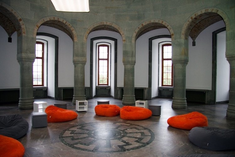 The Obergruppenführersaal in the North Tower of Wewelsburg with the sun-wheel floor mosaic