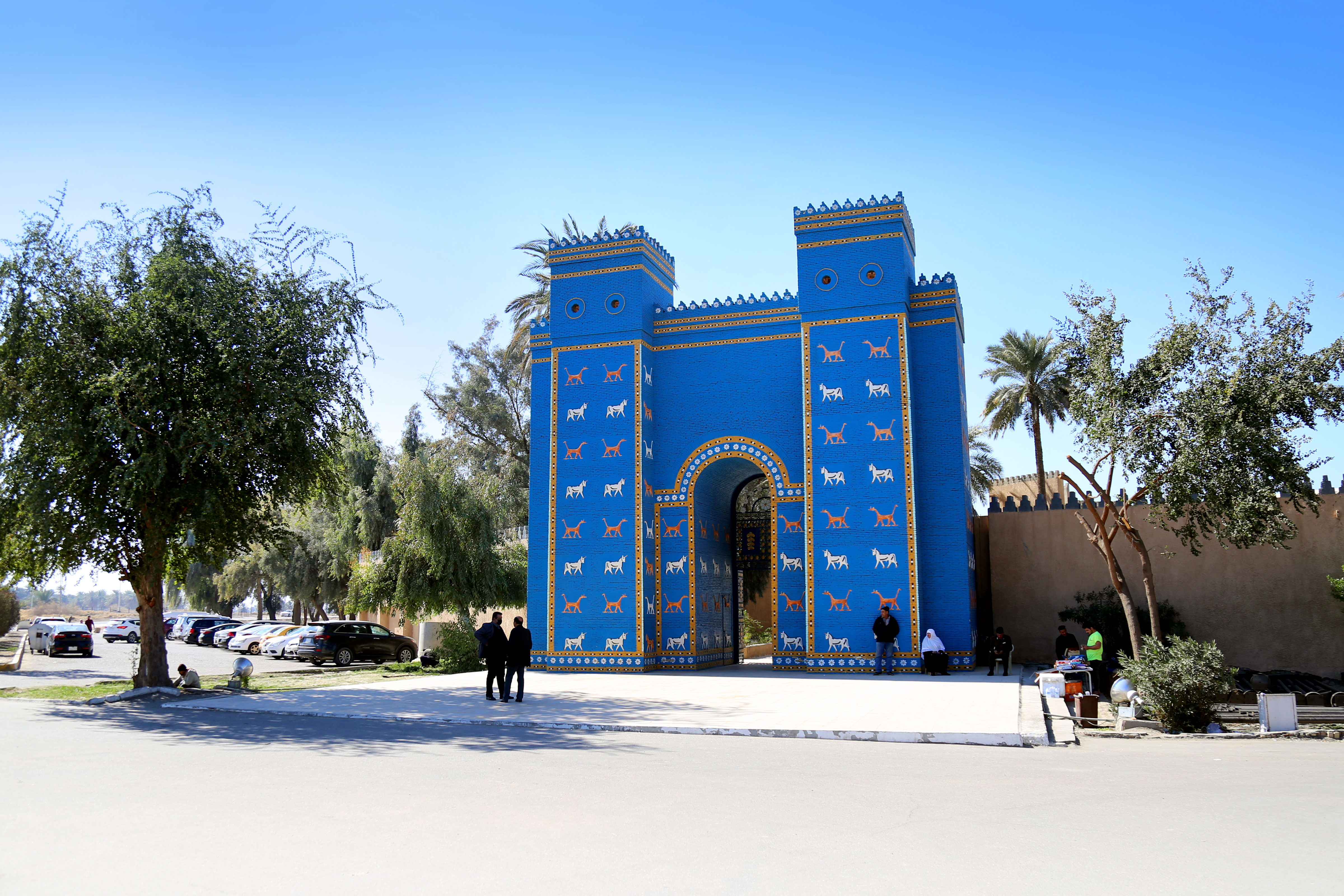 Ancient ruins of Babylon with reconstructed walls under clear Iraqi sky