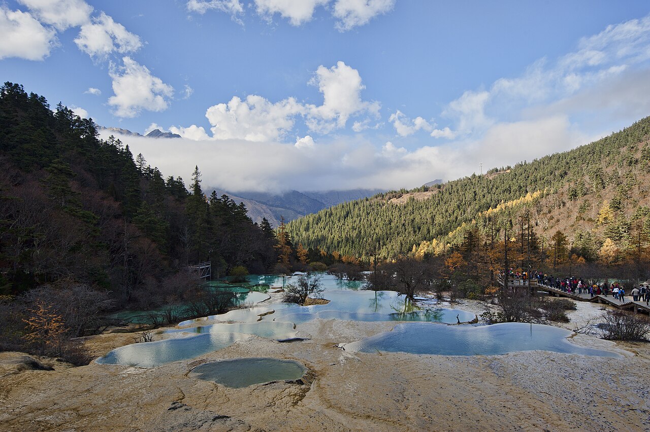 Terraced travertine pools turquoise water Huanglong Songpan Sichuan China