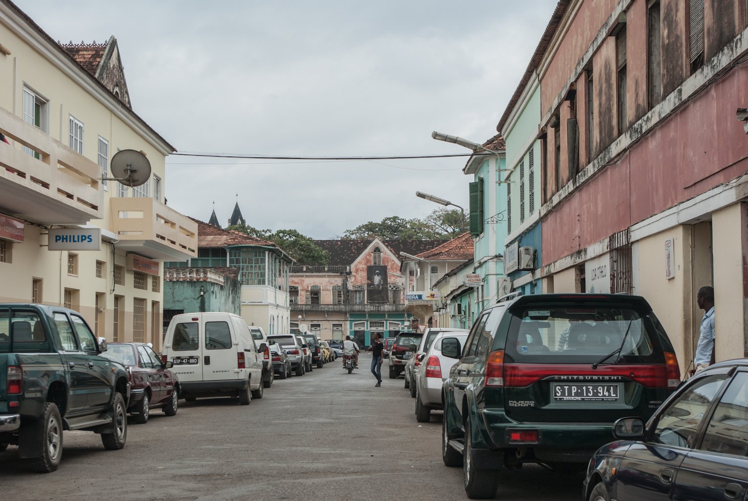 Street scene in São Tomé city with colonial-era buildings and pedestrians
