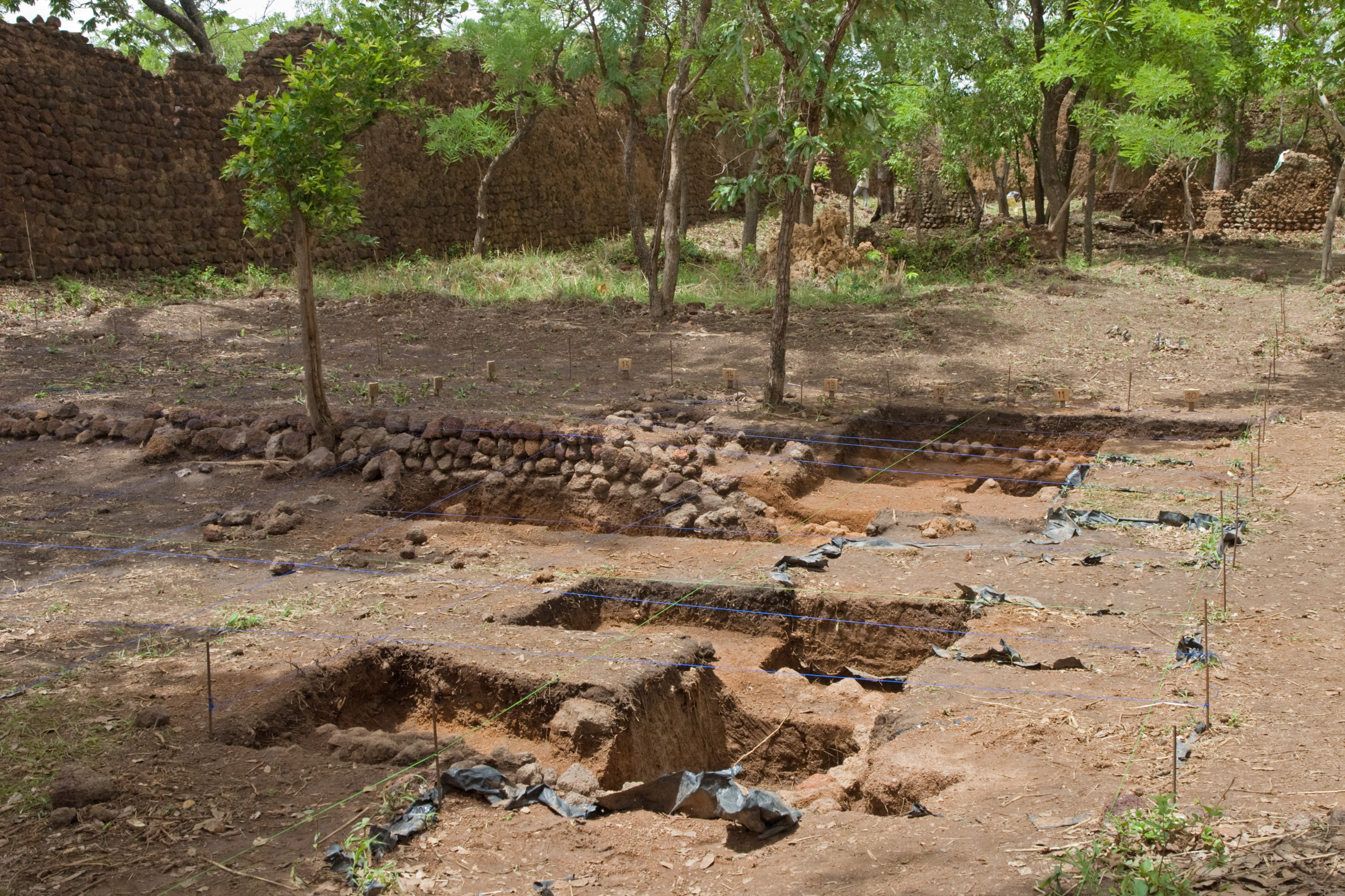 Archaeological excavation trenches at the Ruins of Loropéni revealing stone foundations, Burkina Faso