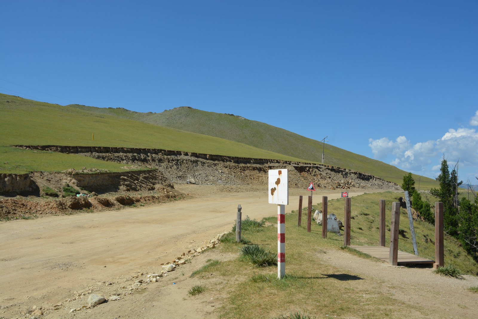 Wide green valley with river bend and steppe grasslands in central Mongolia