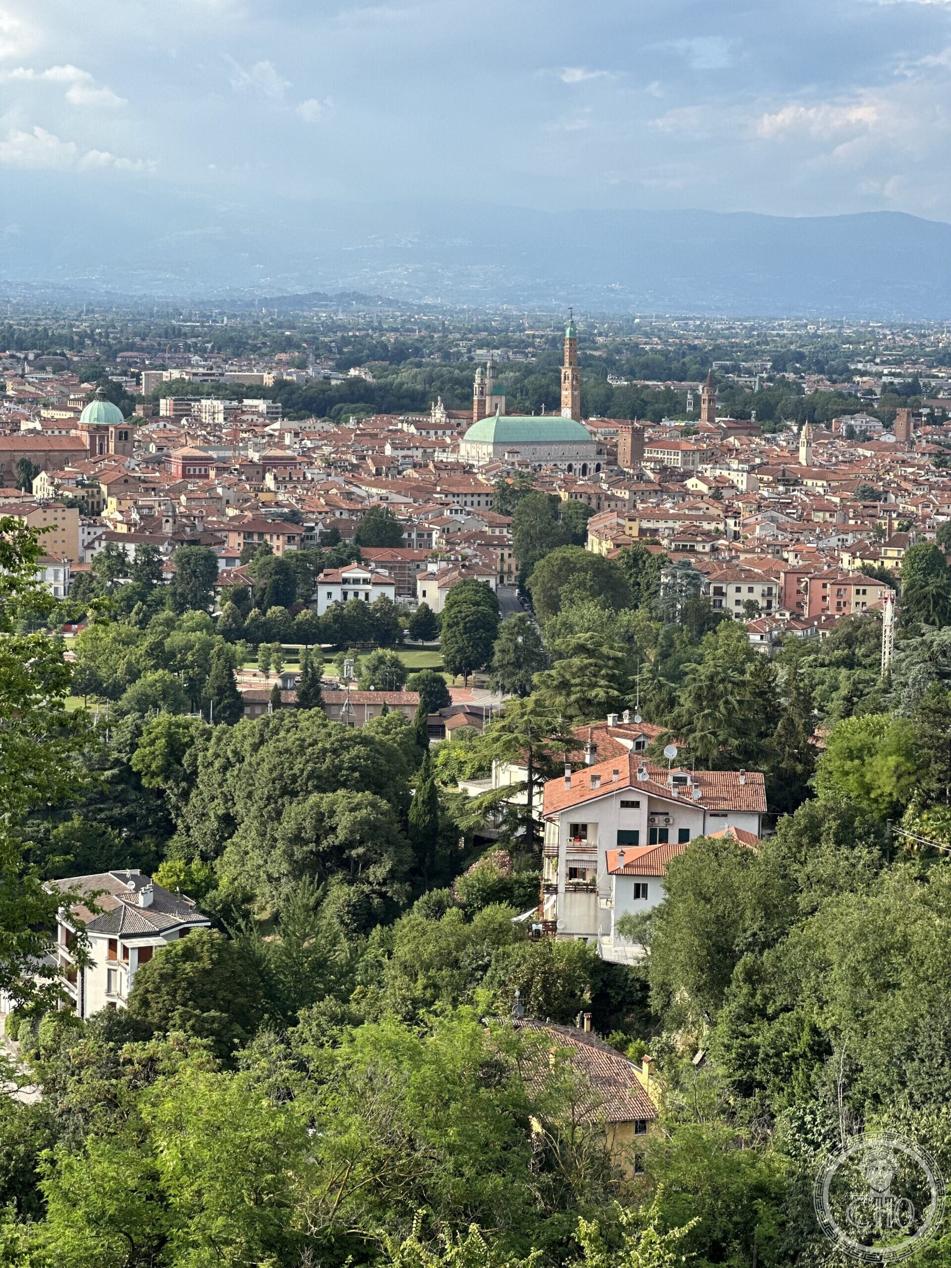 View over Vicenza from Monte Berico, with the green dome of the Basilica Palladiana visible among the rooftops