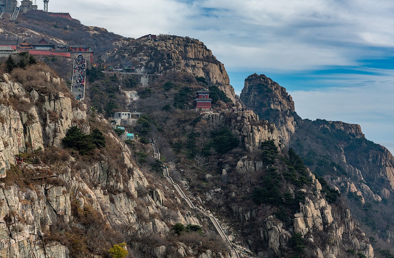 Stone steps and temple rooftops on Mount Taishan Shandong China