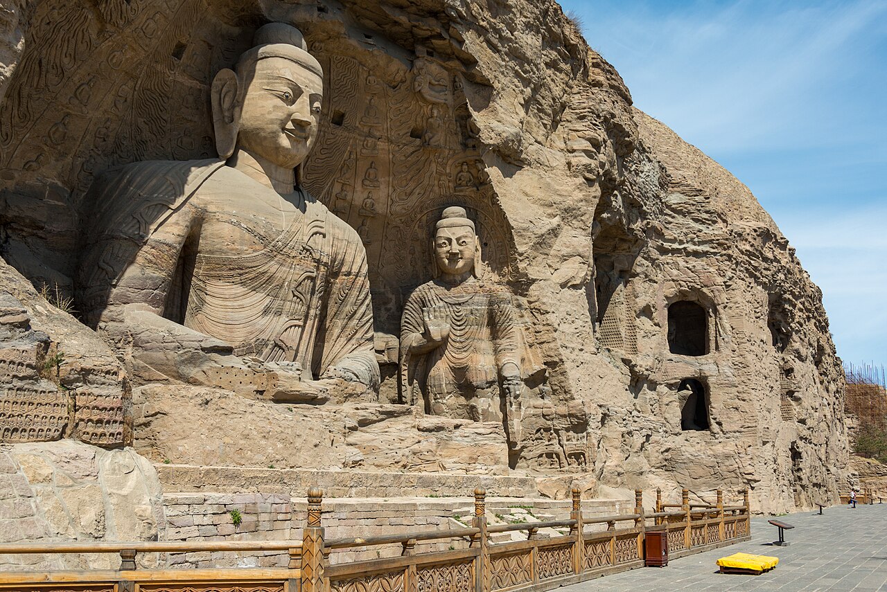 Yungang Grottoes Buddha statues carved into sandstone cliff Datong China