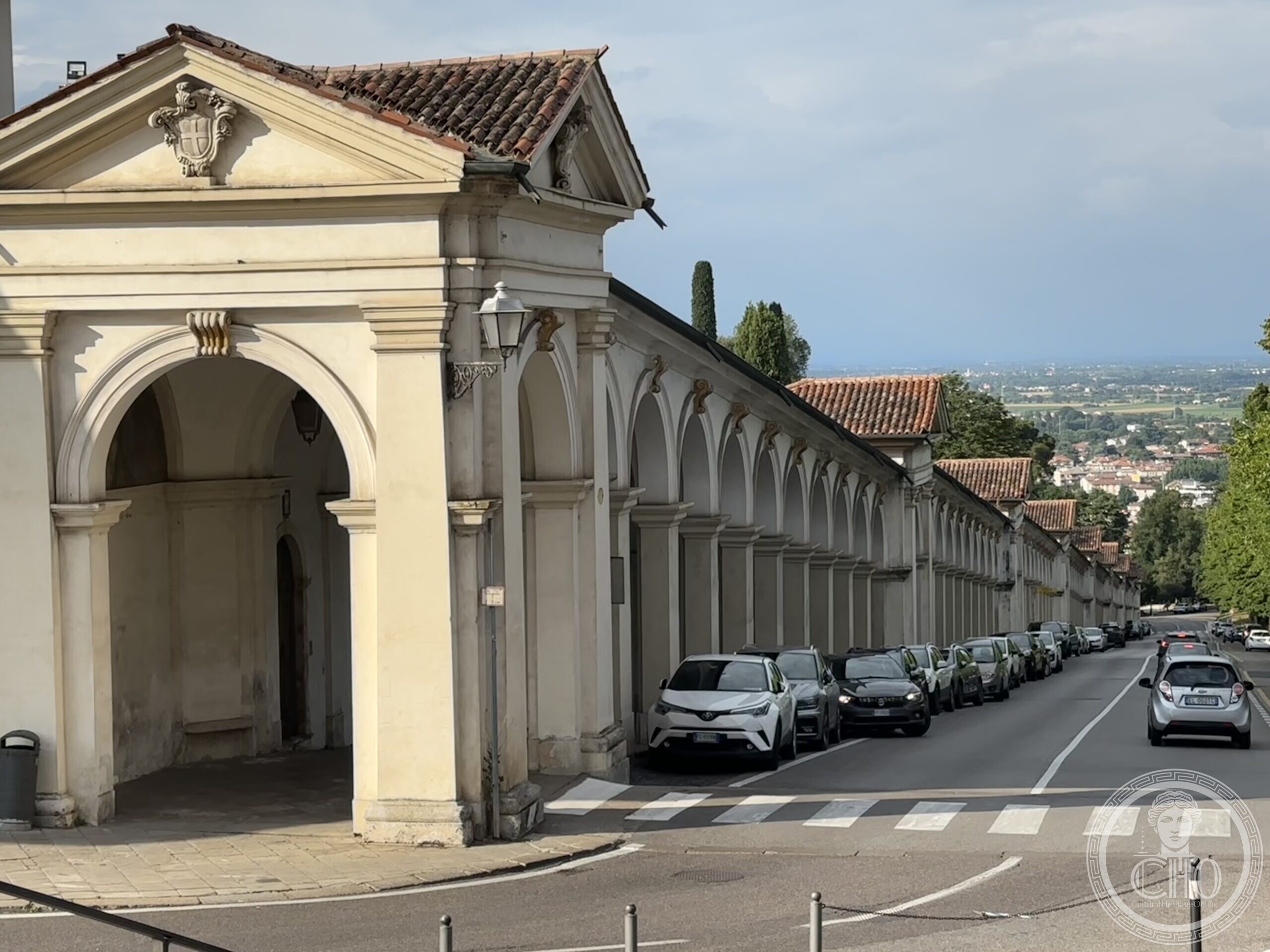 Exterior view of the covered portico leading to Monte Berico, Vicenza, with the plain visible beyond