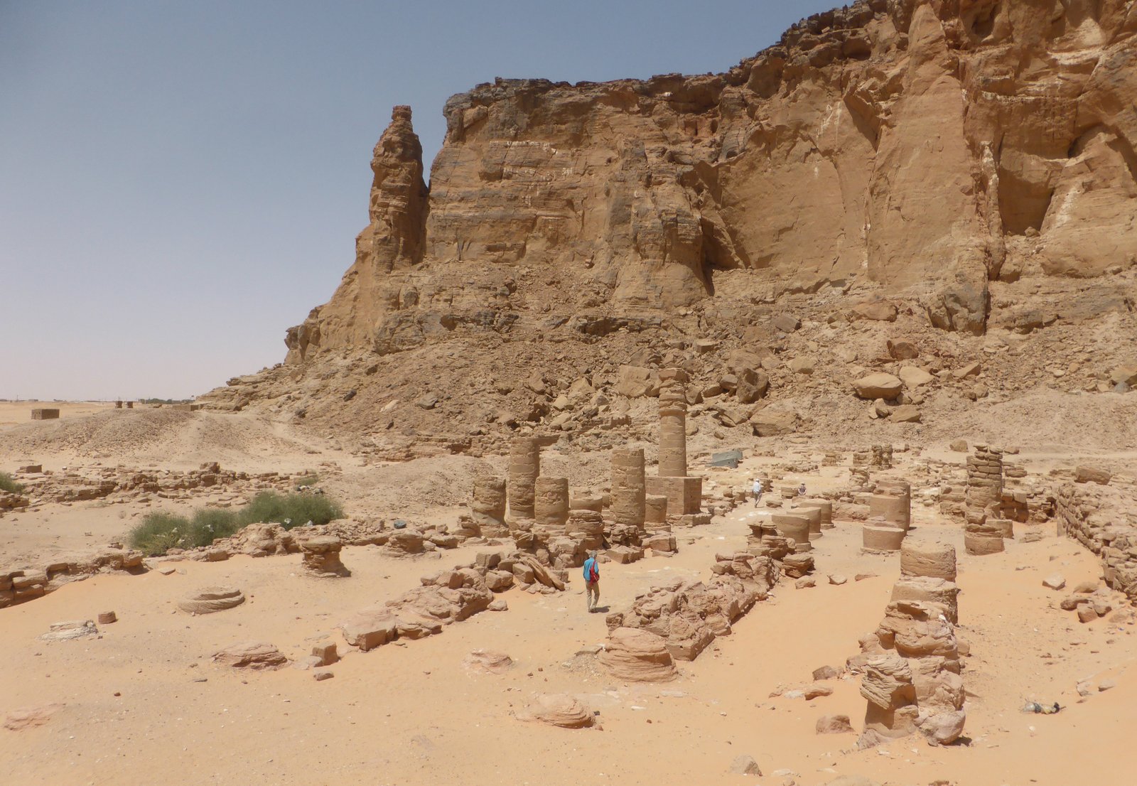 Sandstone columns and ruins of the Amun temple at the base of Jebel Barkal mountain