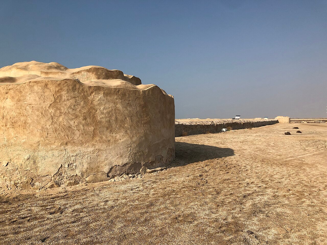 Ruins of the ancient walled town of Al Zubarah stretching across desert terrain, Qatar