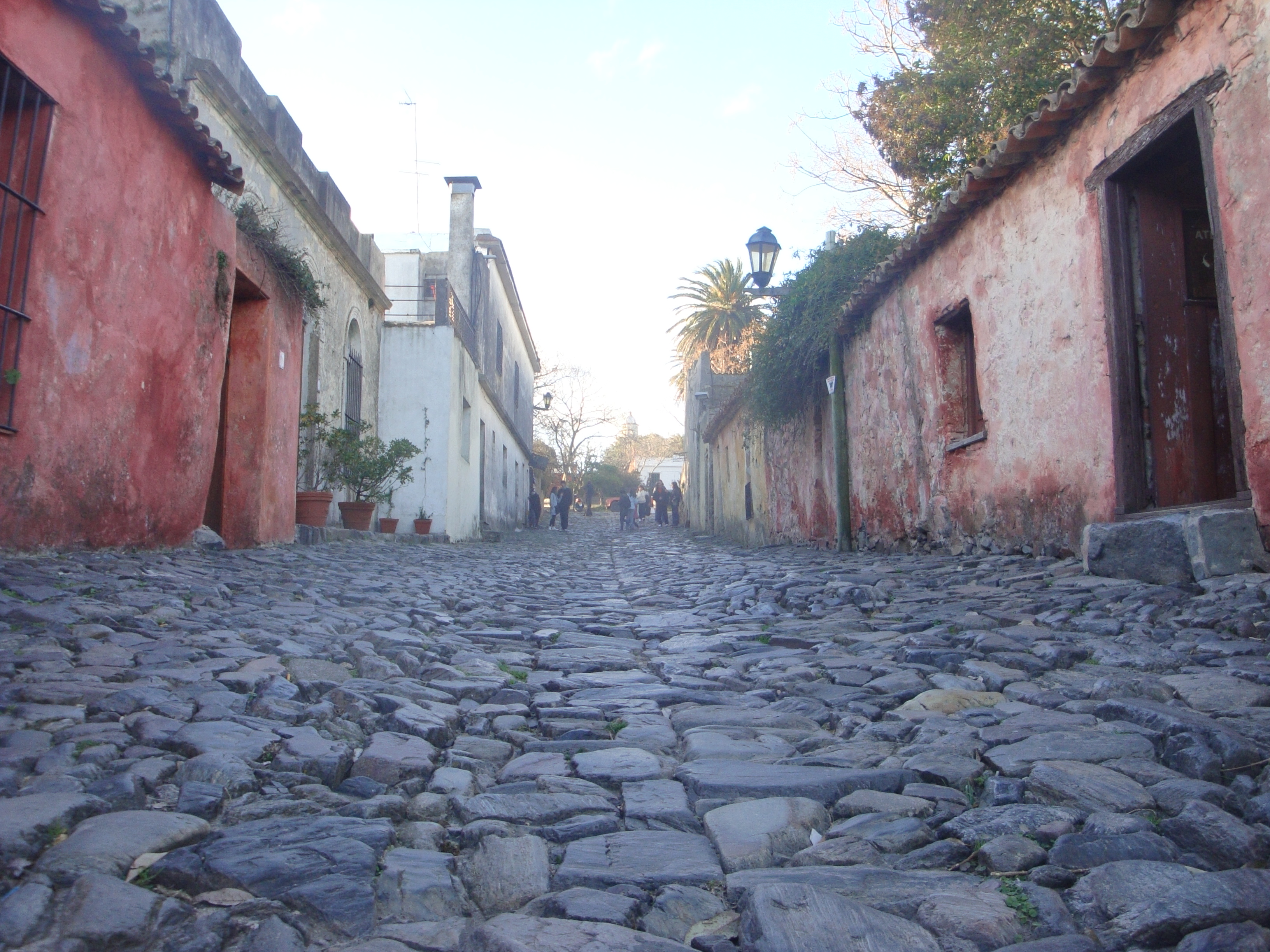 Cobblestone Calle de los Suspiros lined with low colonial houses in Colonia del Sacramento