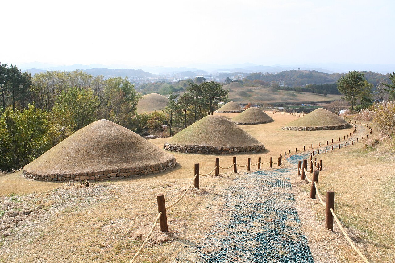 The hemispherical grass-mounded tumuli of the Gaya confederacy royal burial ground at Changnyeong, South Gyeongsang Province, South Korea — one of the seven cluster components of the Gaya Tumuli inscribed as UNESCO World Heritage in 2023