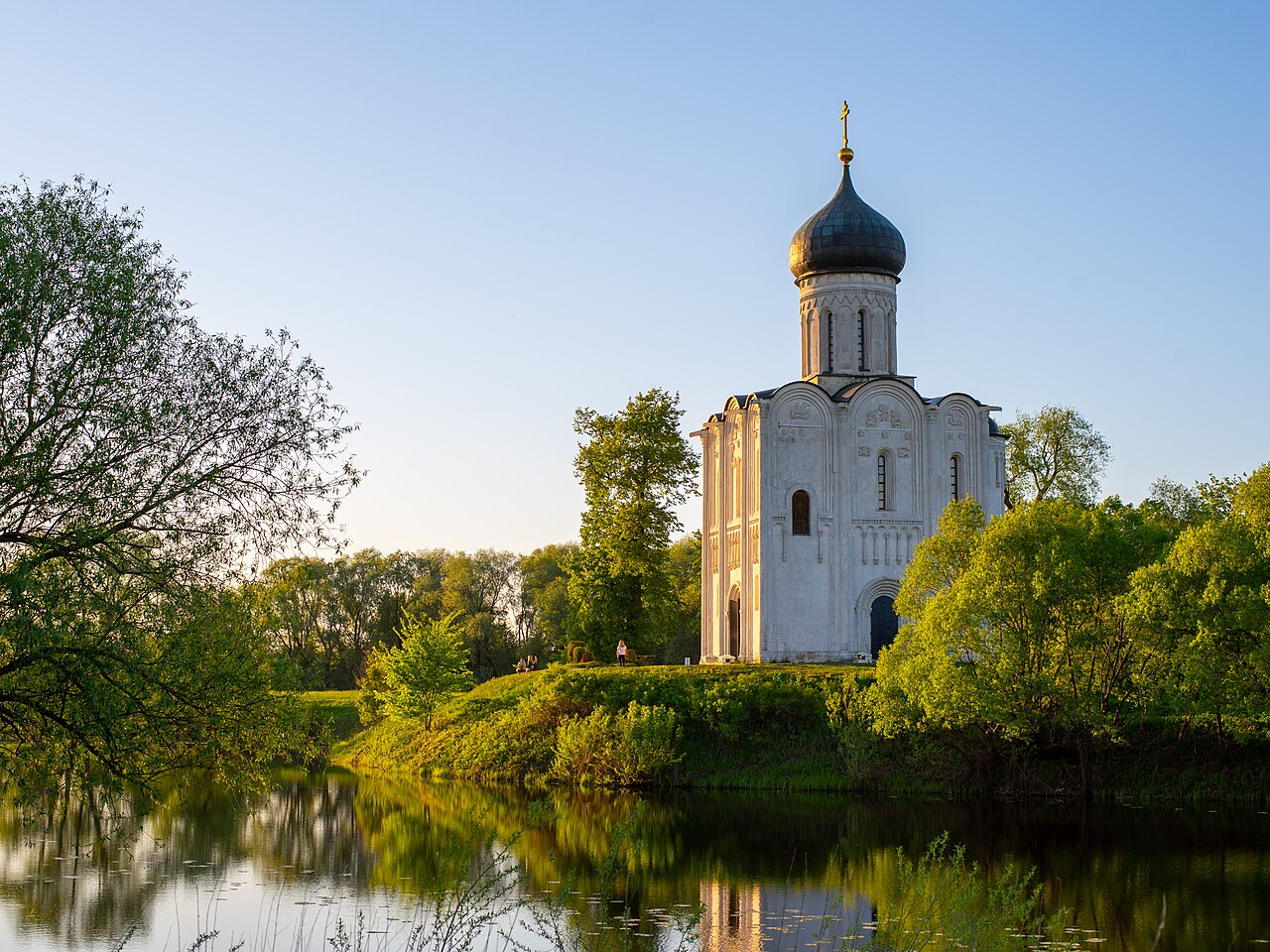 Church of the Intercession on the Nerl, Bogolyubovo, Vladimir Oblast — a solitary 12th-century white stone church reflected in the floodplain, built by Andrei Bogolyubsky in 1165