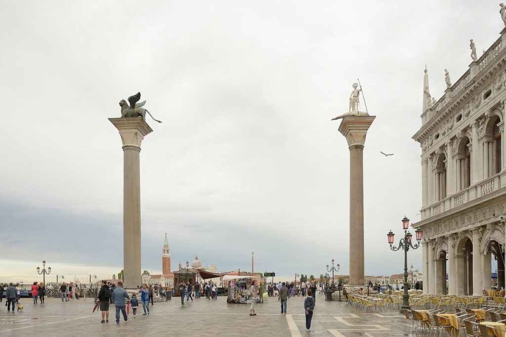 The two granite columns at the water's edge of the Piazzetta, carrying the lion of St Mark and San Todaro