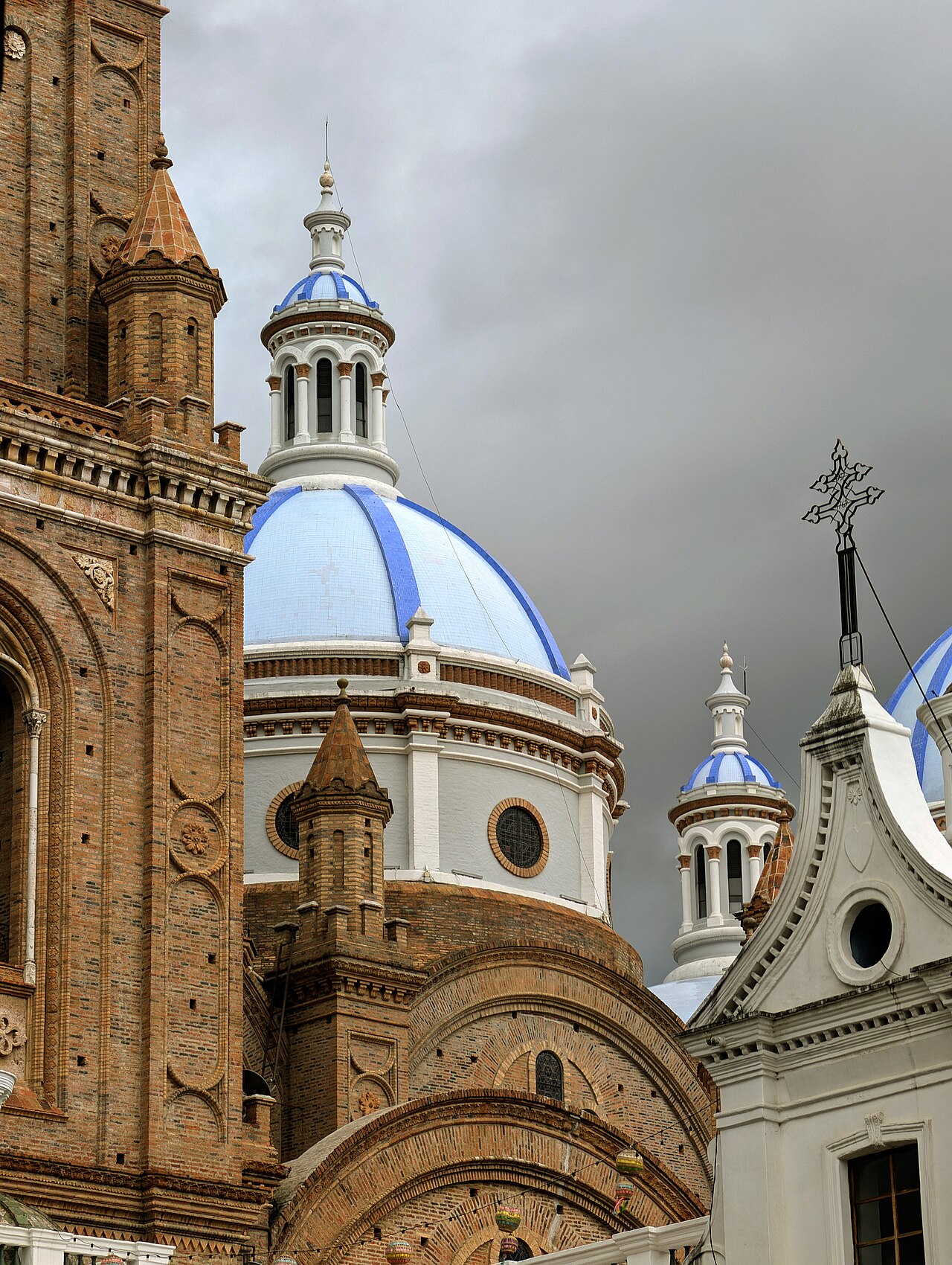 The blue domes (cupolas) of the New Cathedral of Cuenca (Catedral de la Inmaculada Concepción), Cuenca, Ecuador — the pale blue glazed ceramic domes of the largest cathedral in Ecuador, begun in 1880 CE on the main square of the UNESCO-inscribed Historic Centre of Santa Ana de los Ríos de Cuenca, the colonial city built in 1557 on the ruins of the Inca city of Tomebamba