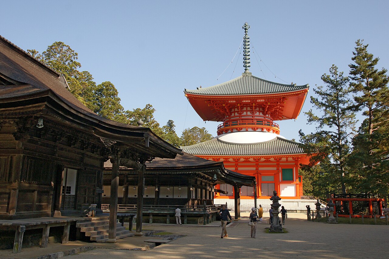 The vermilion wooden pagoda and halls of Danjogaran, the central sacred complex of Koyasan, surrounded by ancient cedar trees in the Kii Mountains, Wakayama Prefecture, Japan