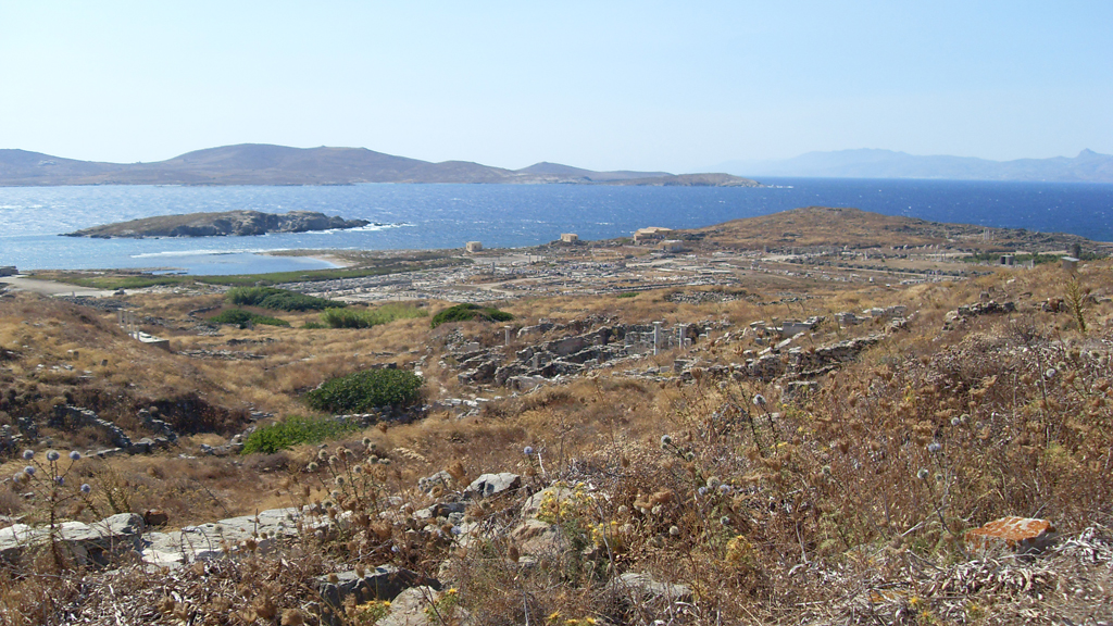 General view of the archaeological ruins on Delos island, Greece — the uninhabited birthplace of Apollo and one of the most important sanctuaries of the ancient world