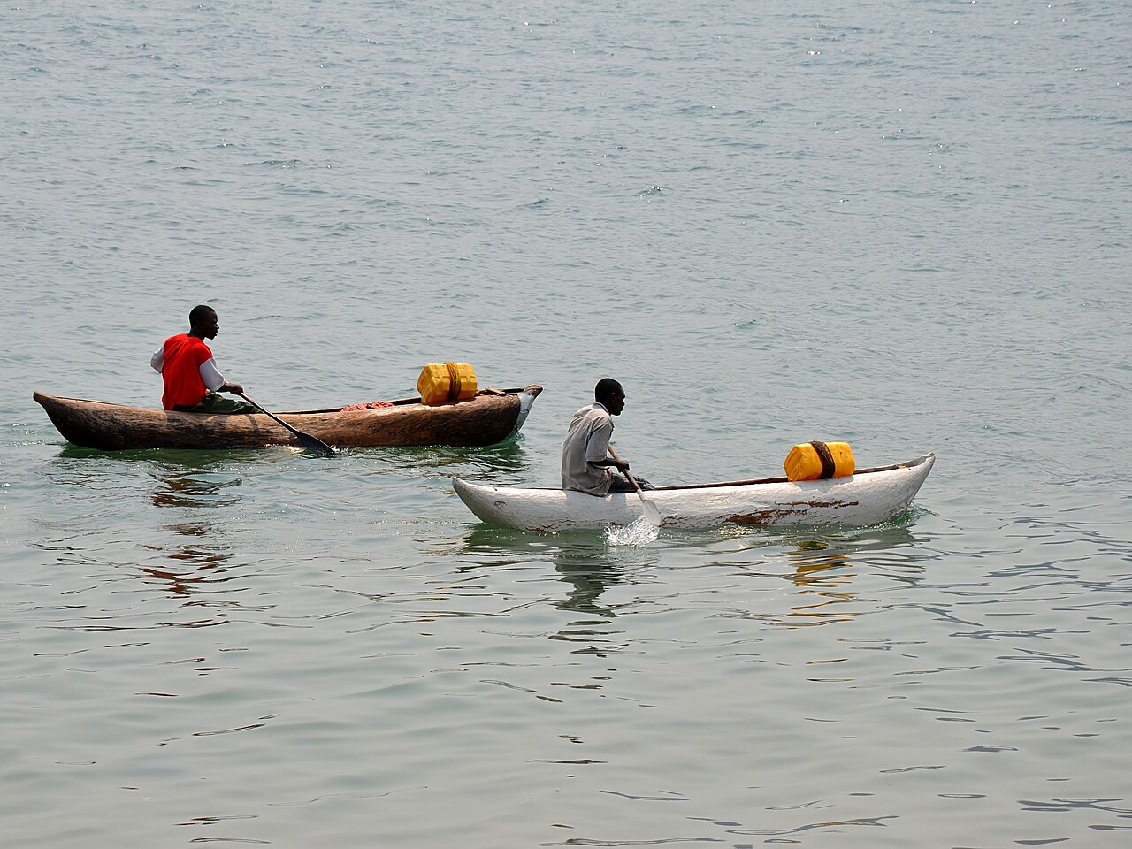 Traditional dugout canoes moored on the clear waters of Lake Malawi at Cape Maclear