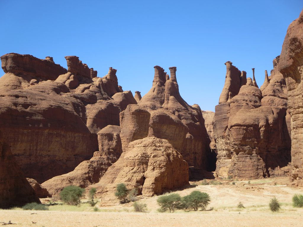 Sandstone hoodoo rock formations in the Ennedi Massif, northeastern Chad — one of the most remote UNESCO World Heritage Sites in the Sahara