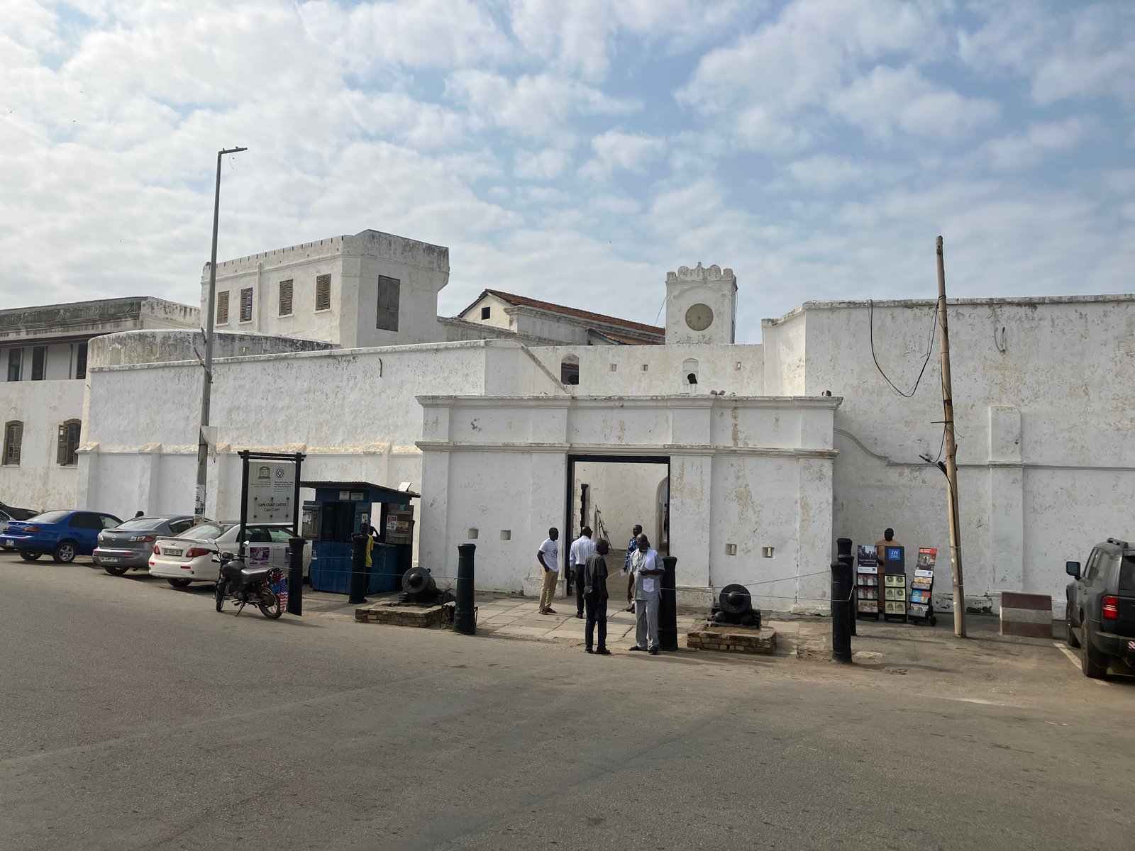 Stone archway entrance of Cape Coast Castle, Ghana, Atlantic Ocean beyond