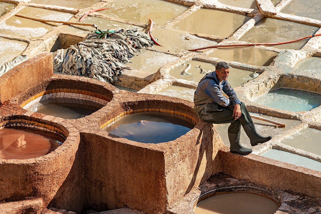 Aerial view of Chouara Tannery stone vats filled with coloured dye in Fez