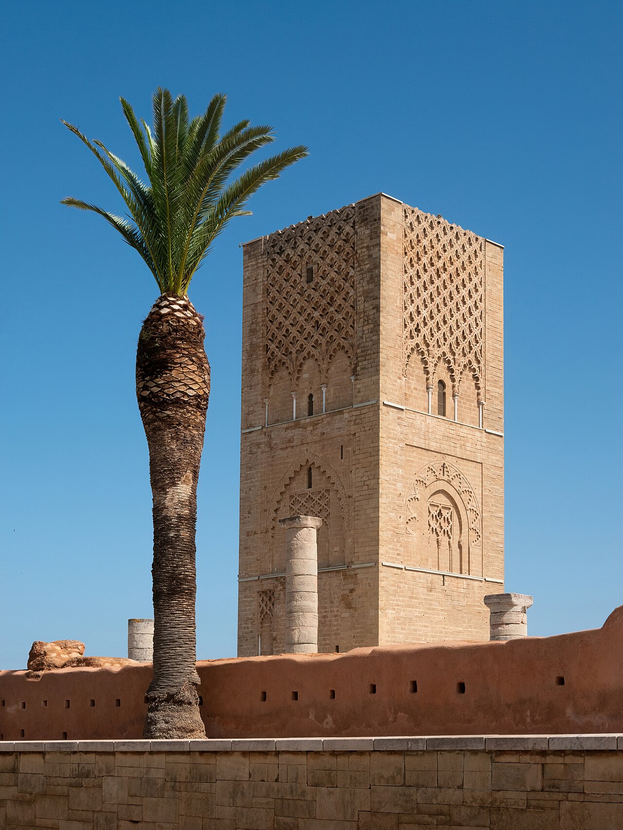 Hassan Tower minaret rising above stone columns in Rabat Morocco