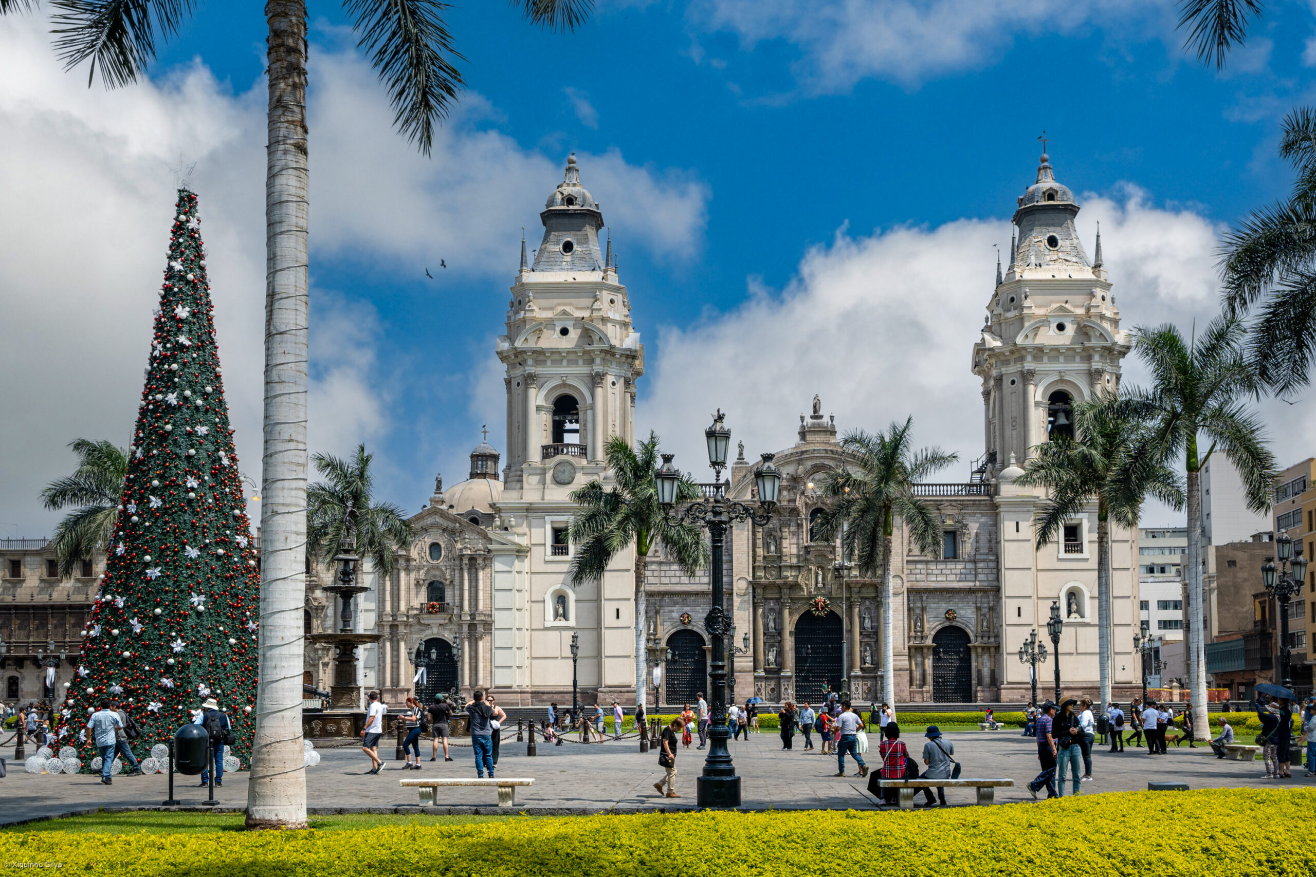 Colonial arcade and church towers in Lima's historic centre at dusk