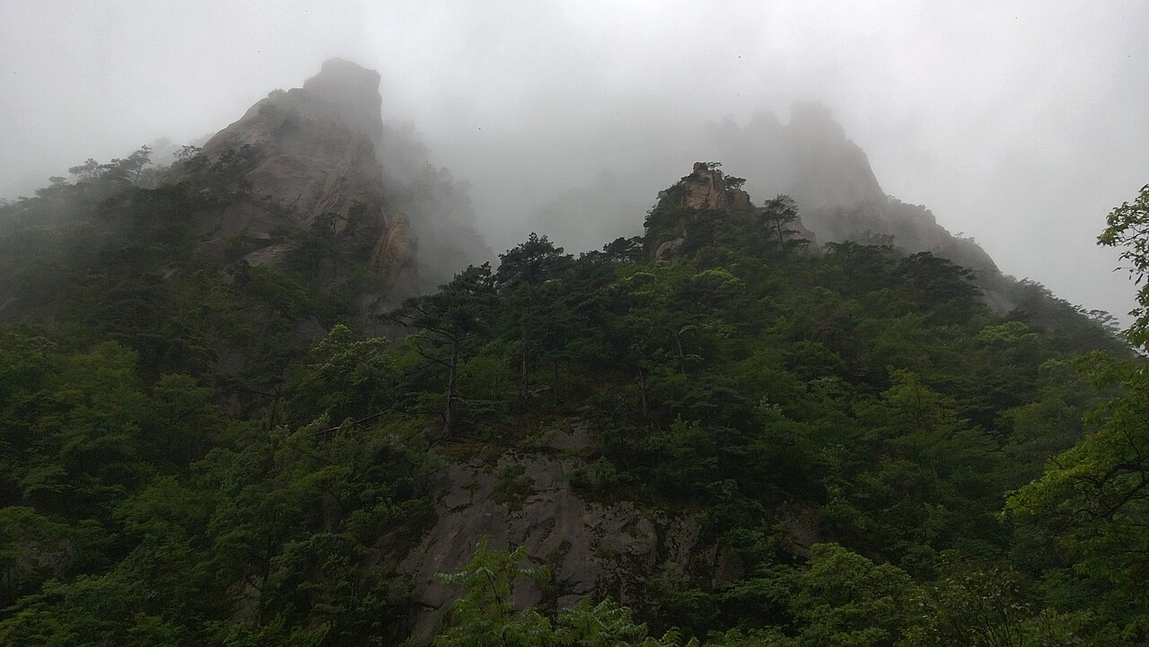 Misty pine trees granite peaks Mount Huangshan Anhui China