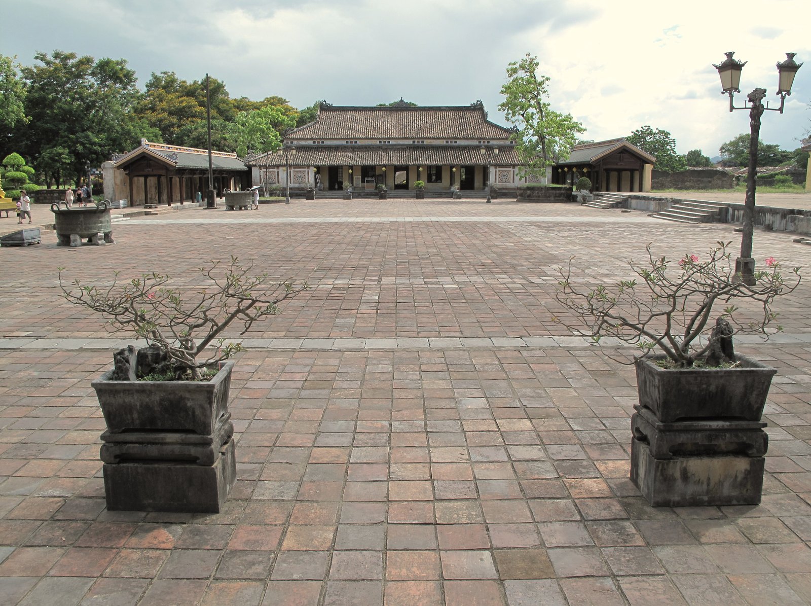 Yellow walls and gate tower of Hue Imperial Citadel viewed across the moat