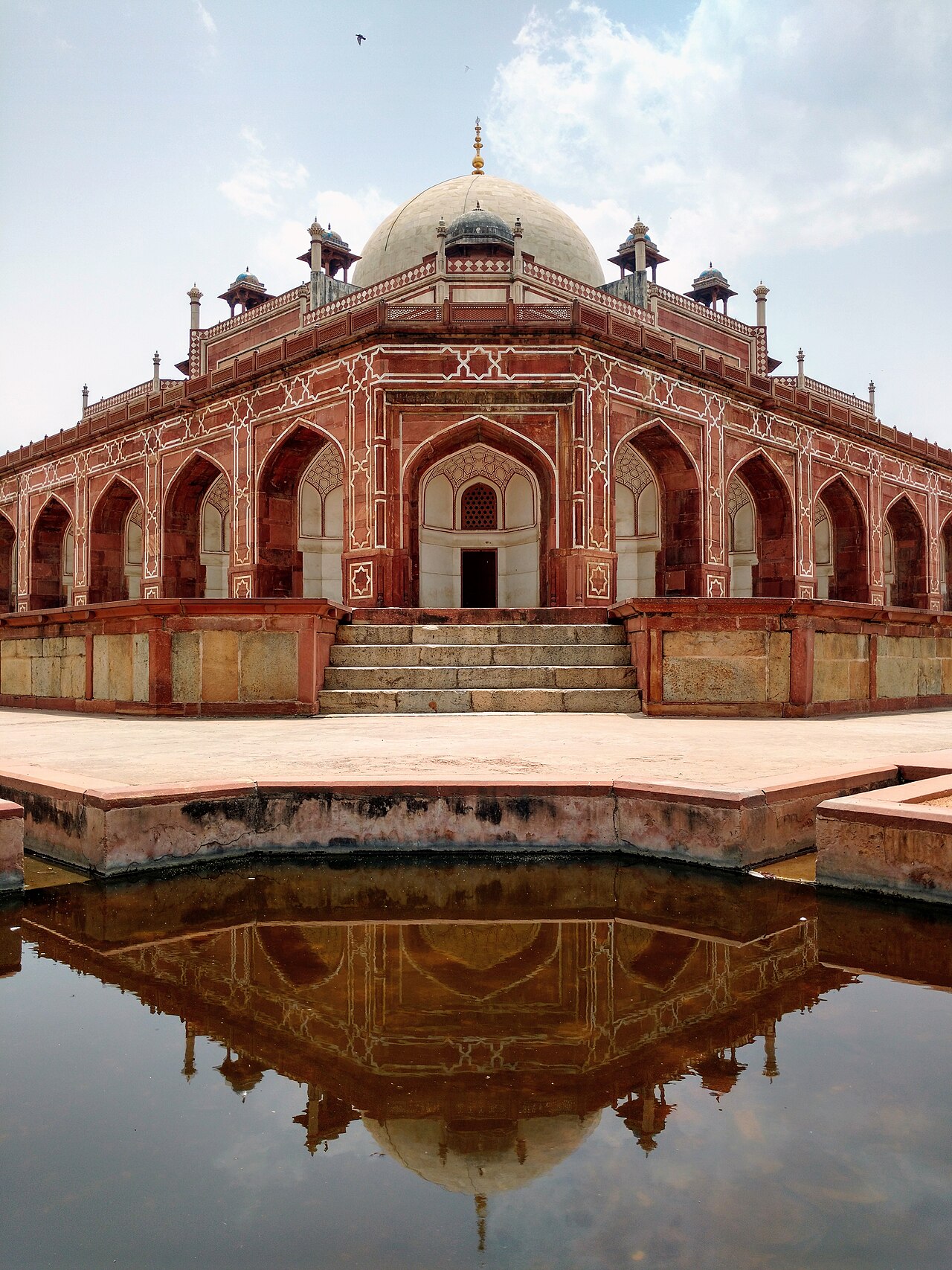 Humayun's Tomb in Delhi, India — a 1570 Mughal mausoleum of red sandstone and white marble, the first garden-tomb in the Indian subcontinent and the architectural forerunner of the Taj Mahal