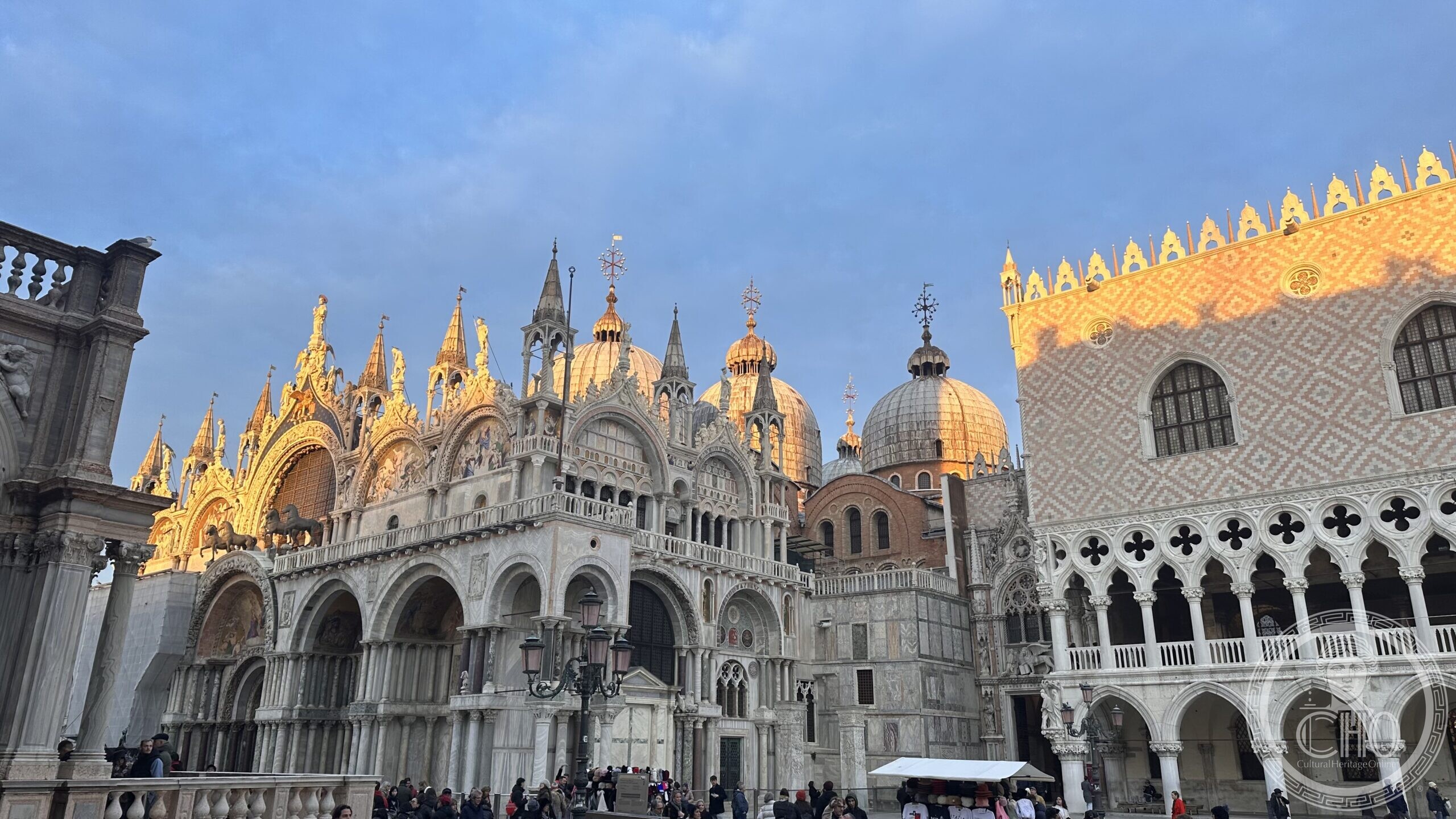 The golden facade of St Mark's Basilica and the Doge's Palace in Piazza San Marco, Venice, lit by the rising sun