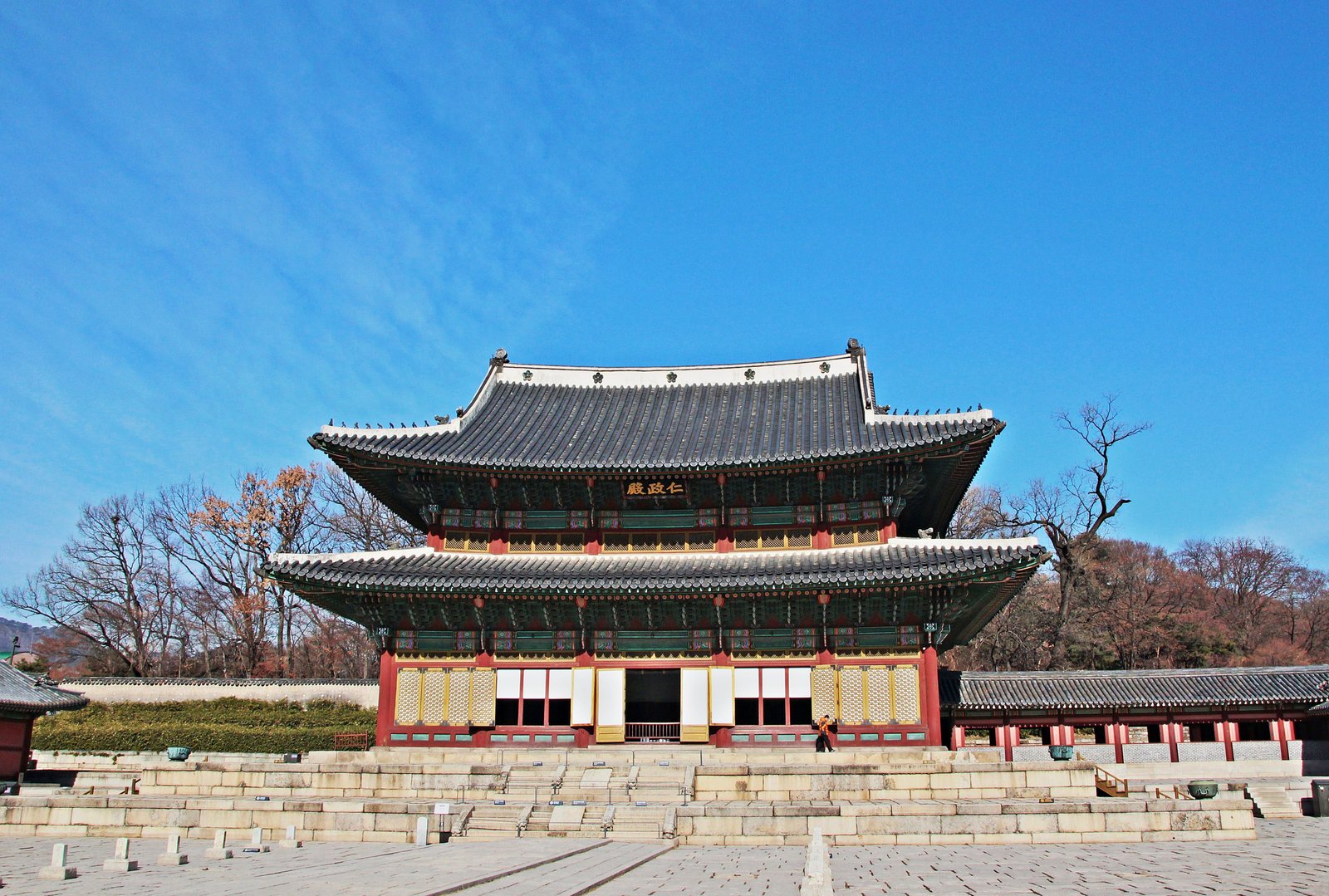 Injeongjeon throne hall of Changdeokgung Palace, a two-storey wooden pavilion with green-tiled roof on a raised stone platform