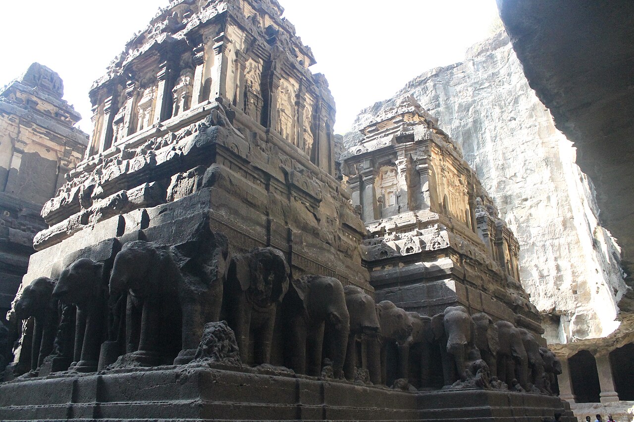 The Kailasa Temple (Cave 16) at Ellora, Maharashtra, India — the largest rock-cut temple in the world, carved entirely from a single basalt rock mass approximately 757–773 CE during the Rashtrakuta dynasty, a complete freestanding Shaivite temple 276,000 tonnes of rock excavated from above it, UNESCO World Heritage inscribed in 1983