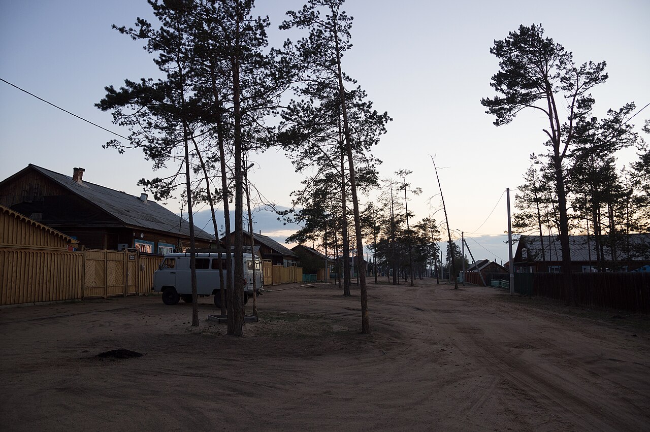 Wooden village of Khuzhir on Olkhon Island with Lake Baikal visible beyond