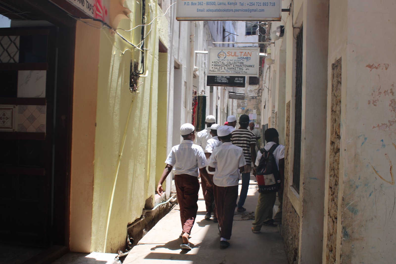 Lamu Old Town narrow street coral stone buildings Kenya