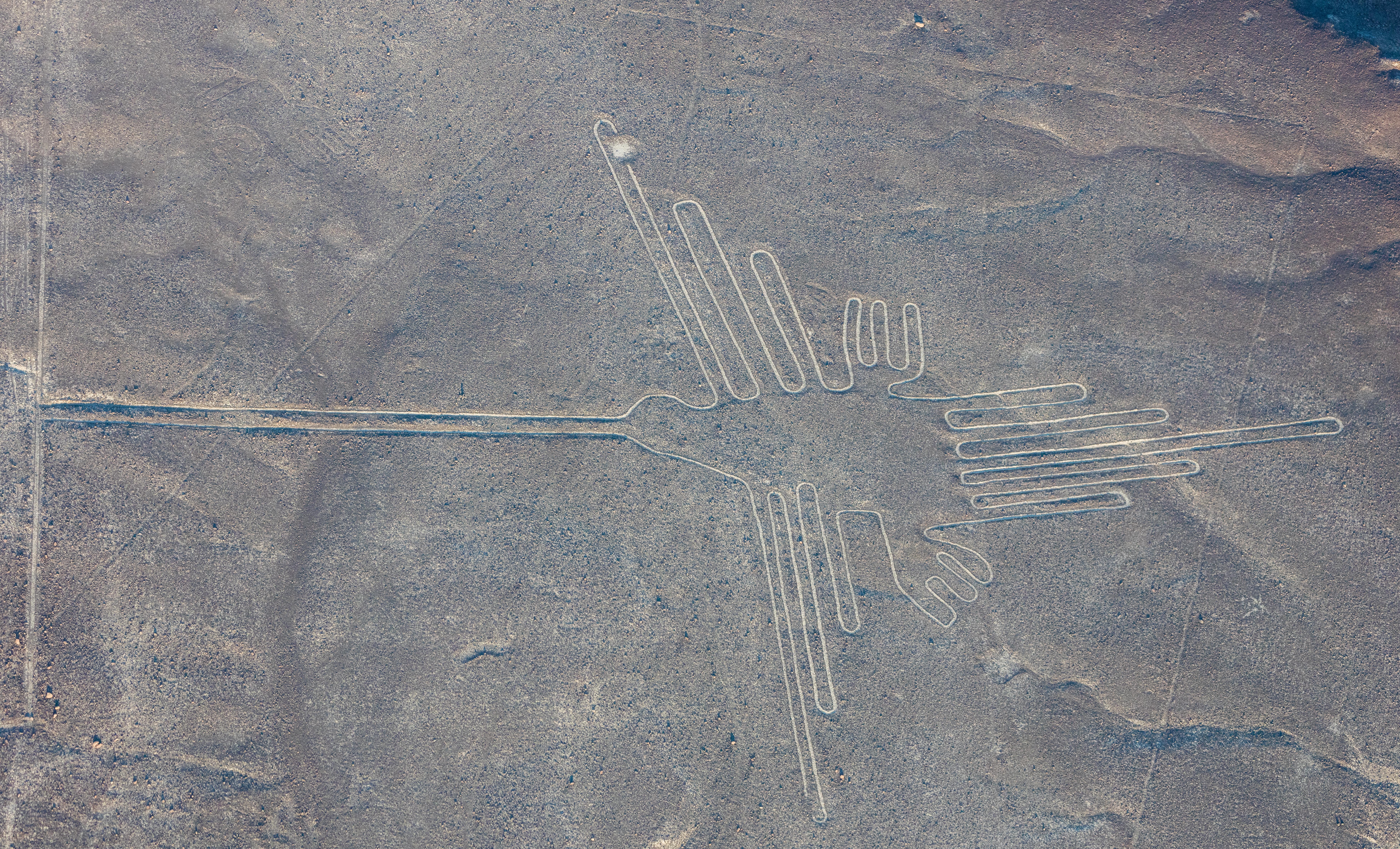 Aerial view of the Nazca hummingbird geoglyph scratched into the Peruvian desert floor