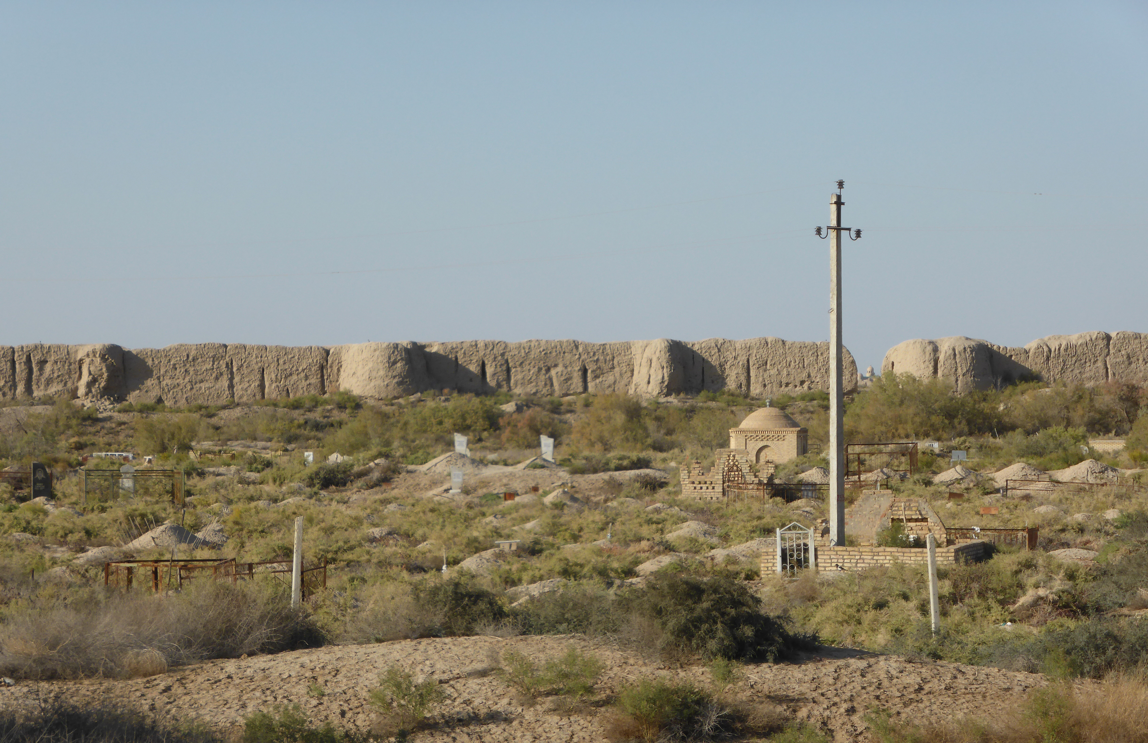 Massive ancient earthen city walls of Merv stretching across the desert landscape