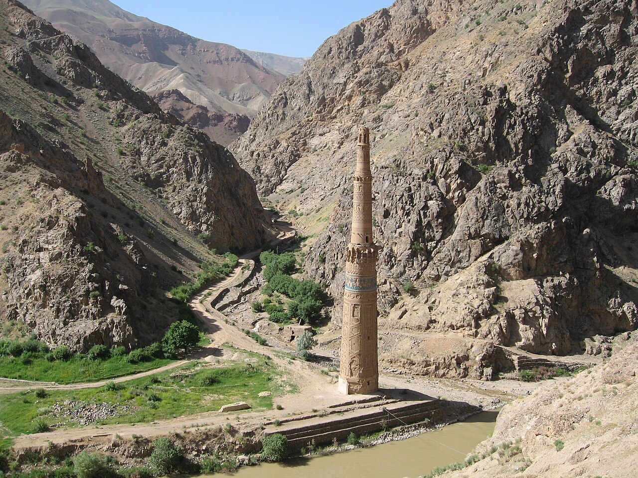Minaret of Jam rising from the riverbed gorge in Ghor province Afghanistan surrounded by steep rocky hills
