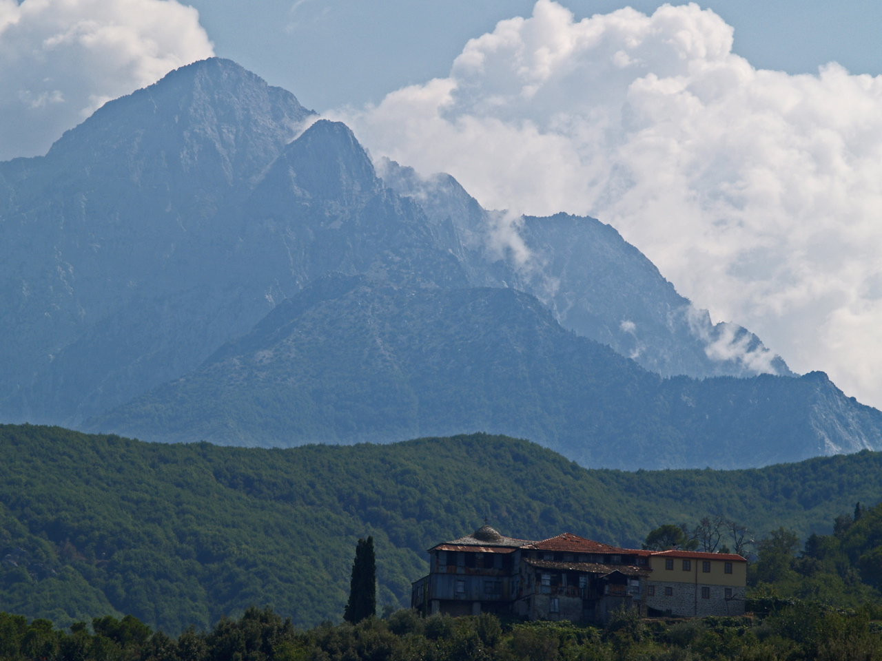 Mount Athos peak rising above the Aegean Sea and forested slopes of the Athos peninsula, northern Greece