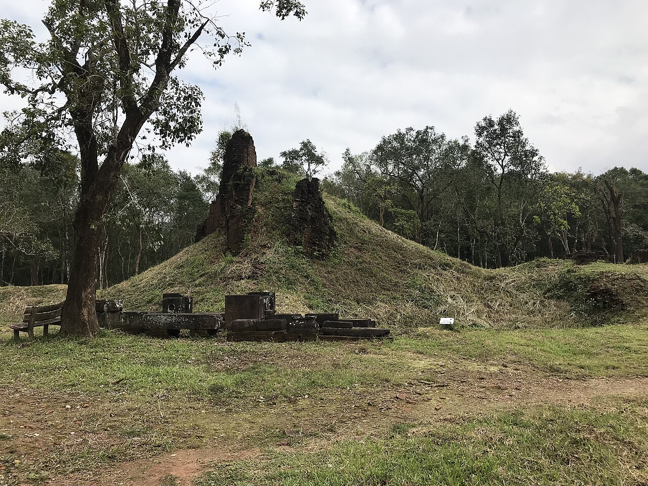 A surviving red-brick Cham Hindu tower at Mỹ Sơn Sanctuary, Quảng Nam Province, Vietnam — one of the Cham towers from Groups E-F of the Mỹ Sơn Sanctuary complex, built by the kings of Champa between the 4th and 13th centuries CE as a royal Hindu religious centre — UNESCO World Heritage Site inscribed 1999 CE