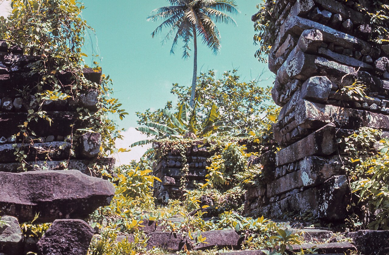 Aerial view of Nan Madol, Pohnpei, Federated States of Micronesia — the ceremonial centre of the Saudeleur dynasty, built on 92 artificial islets of basalt logs and coral fill in the tidal flat southeast of Pohnpei island, the largest archaeological site in the Pacific Islands and UNESCO-inscribed as a World Heritage Site in Danger