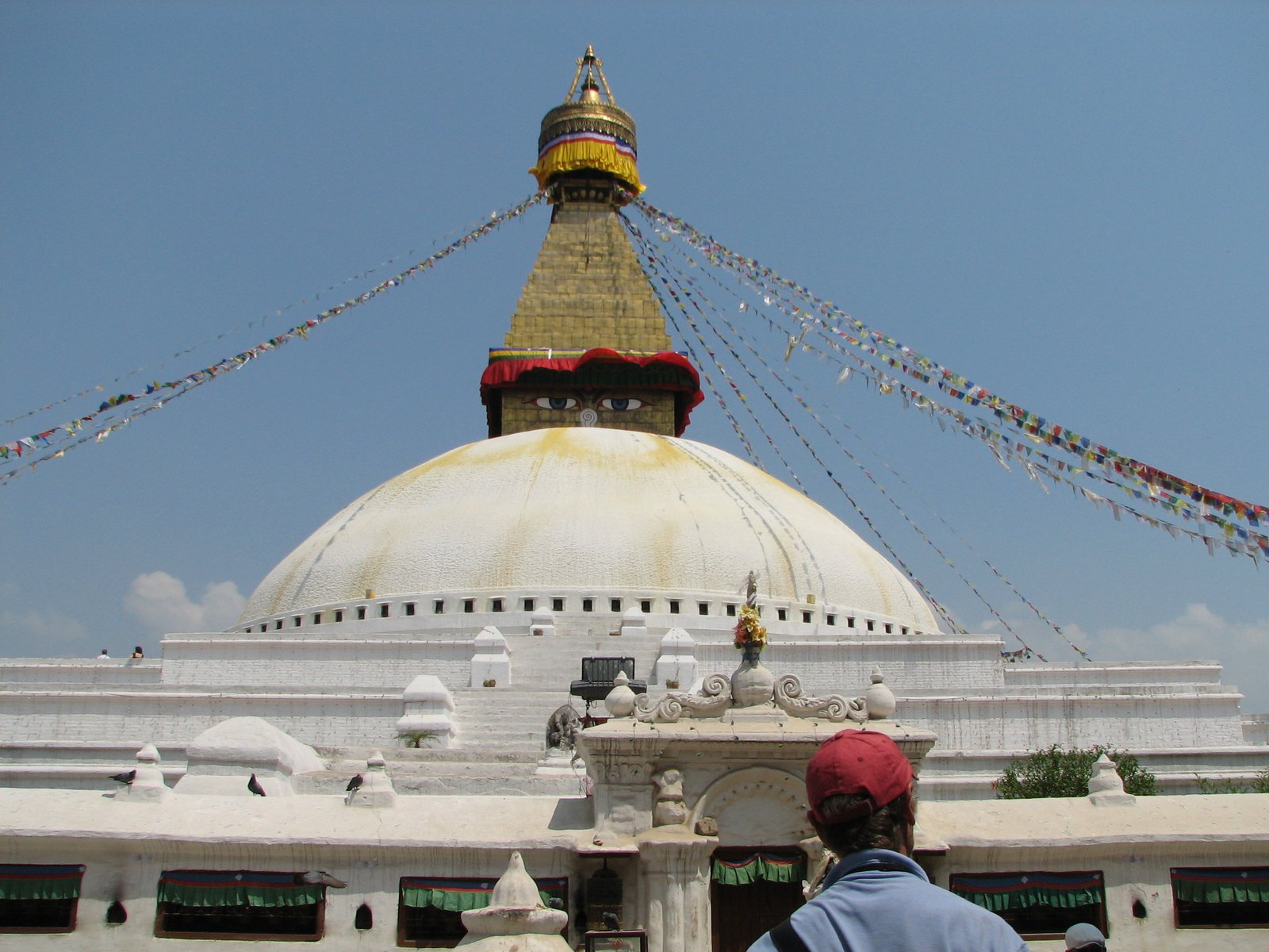 Boudhanath stupa with its painted all-seeing eyes rising above Kathmandu rooftops