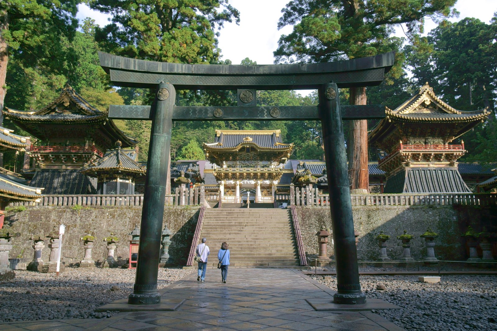 Torii gate and Yōmeimon gate of Nikkō Tōshōgū Shrine amid cedar forest