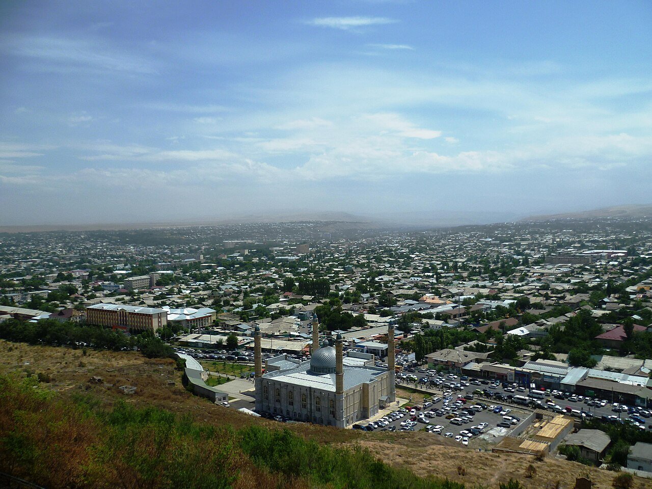 View of Osh city from Sulaiman-Too mountain with mosque in foreground, Kyrgyzstan