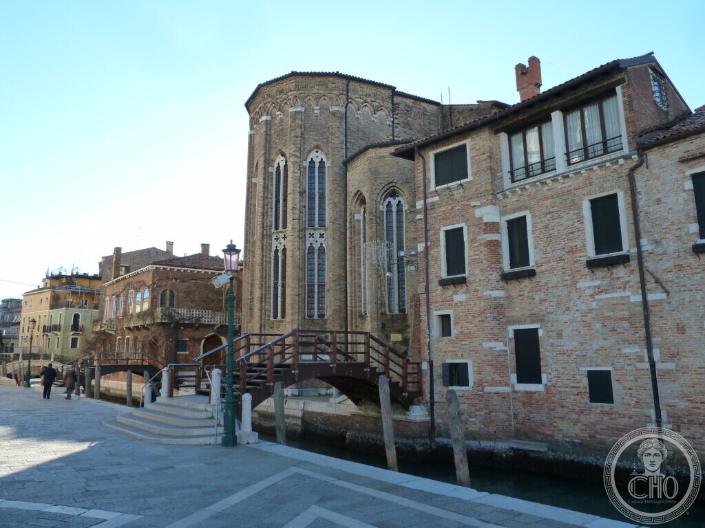 The apse of the former church of San Gregorio seen from the fondamenta, with a timber footbridge in front of it and the abbey buildings to the right