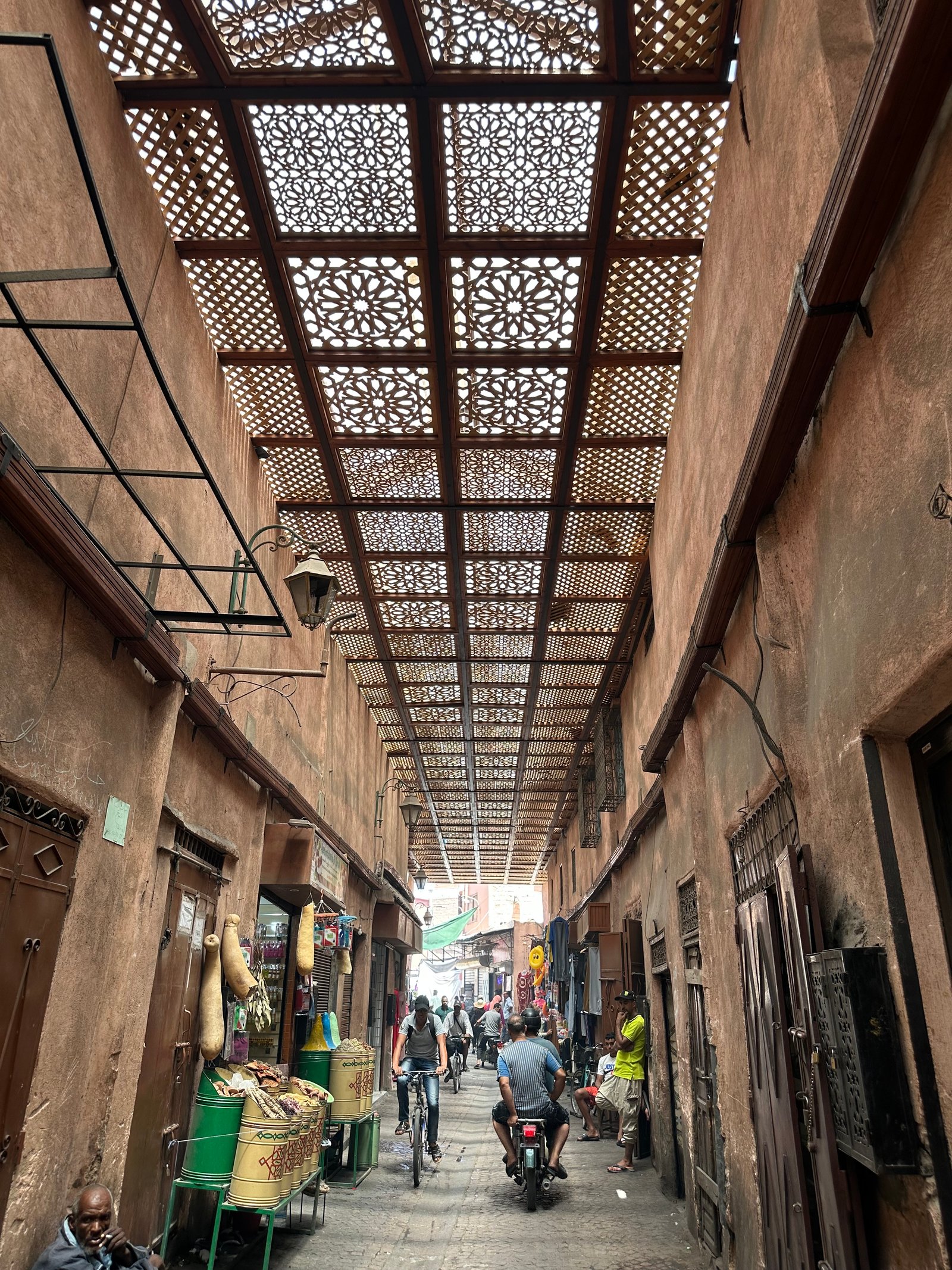Narrow ochre-walled alleyway in the ancient medina of Marrakech