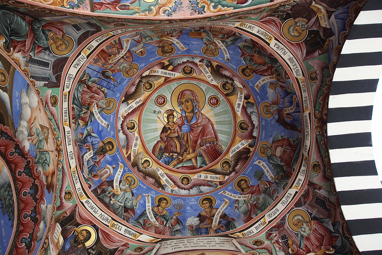 Rila Monastery courtyard arcades and Holy Virgin Church tower in the Rila Mountains Bulgaria