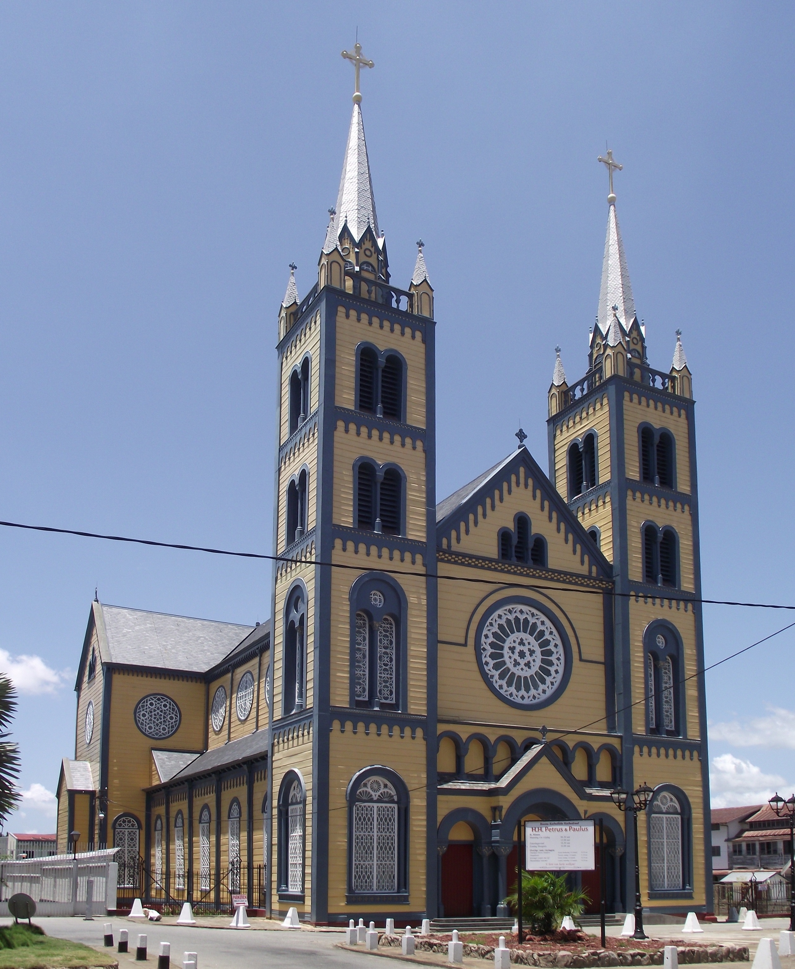Tall timber-framed Saint Peter and Paul Cathedral rising above Paramaribo streetscape