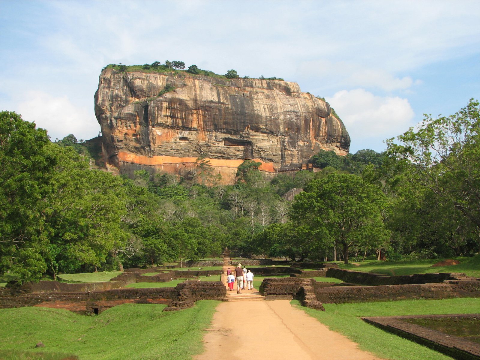 Sigiriya Lion Rock column rising above the Sri Lankan forest, seen from the gardens below