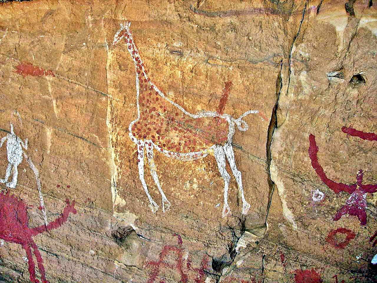 Sandstone rock formations and ancient paintings in the Tadrart Acacus mountains, Fezzan desert, southwestern Libya