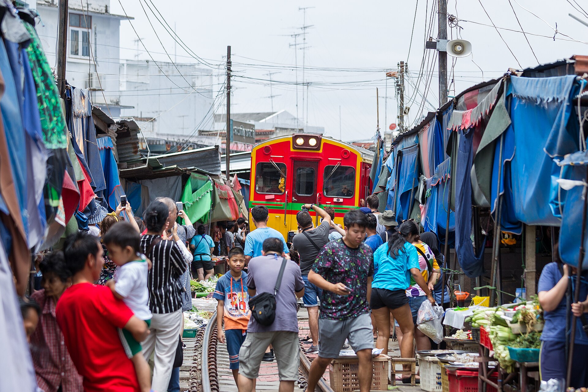Maeklong Railway Market – Talad Rom Hub — via Wikimedia Commons Maeklong Railway Market – Talad Rom Hub — via Wikimedia Commons